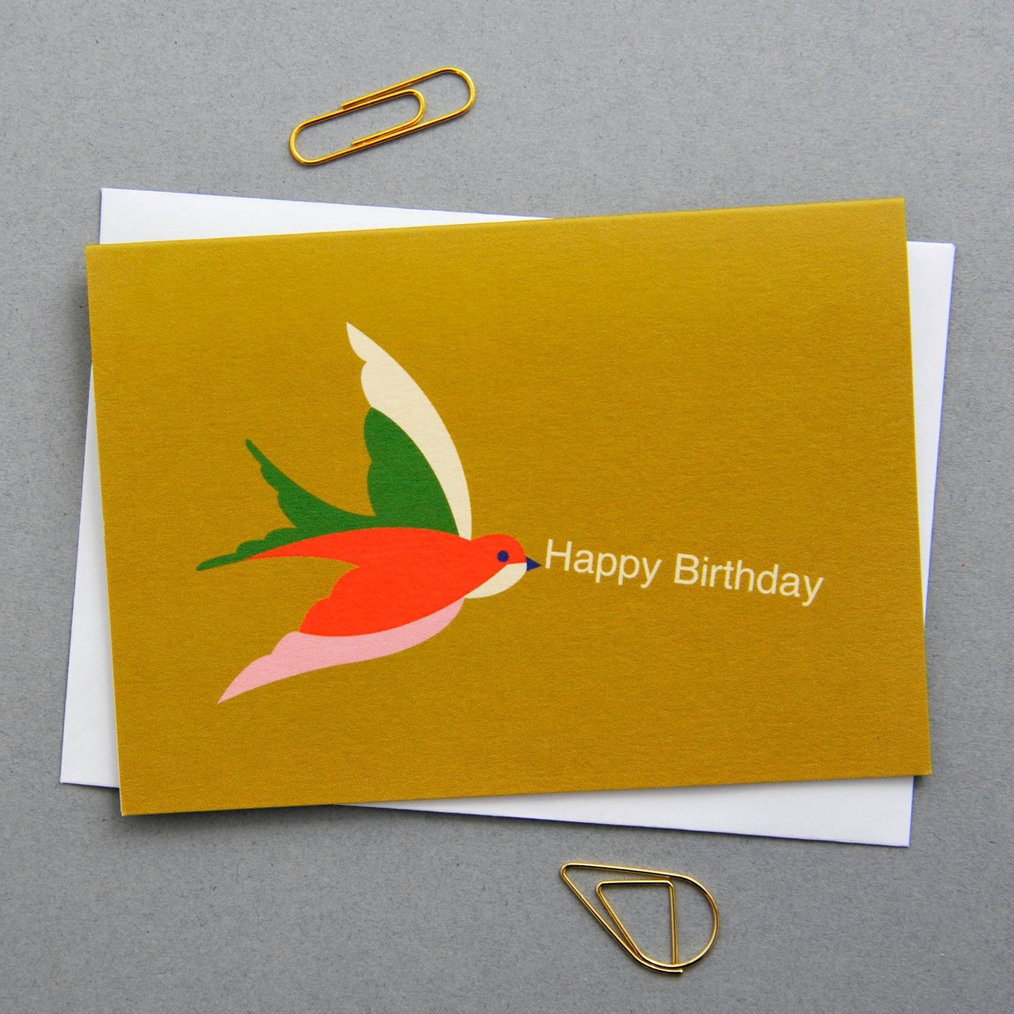 Birthday card with a colorful bird illustration on a gray background