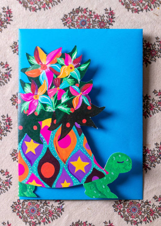 Colorful greeting card with a patterned design on a floral background