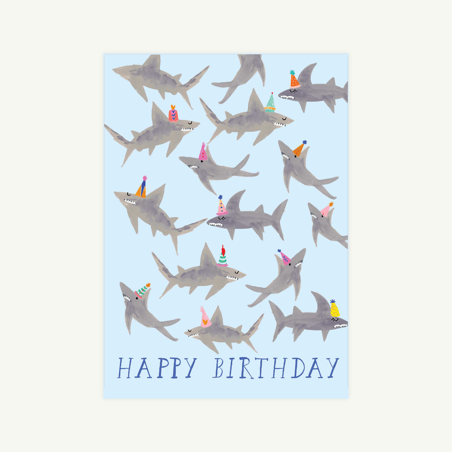 Birthday card with shark illustrations and 'Happy Birthday' text on a light blue background