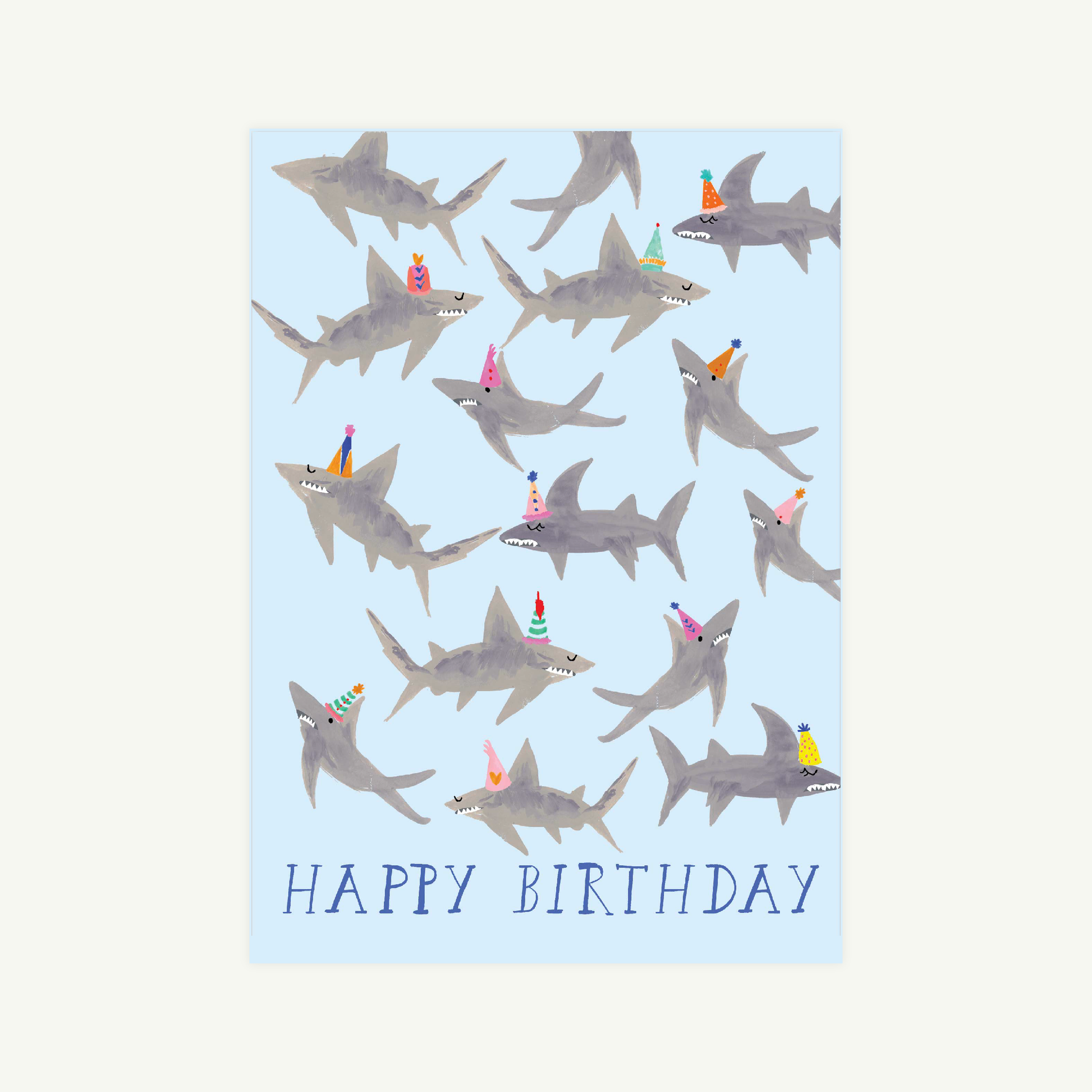 Birthday card with shark illustrations and 'Happy Birthday' text on a light blue background