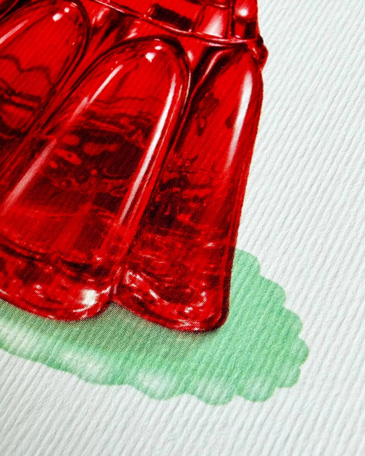 Close-up of a gelly cake in a textured white background