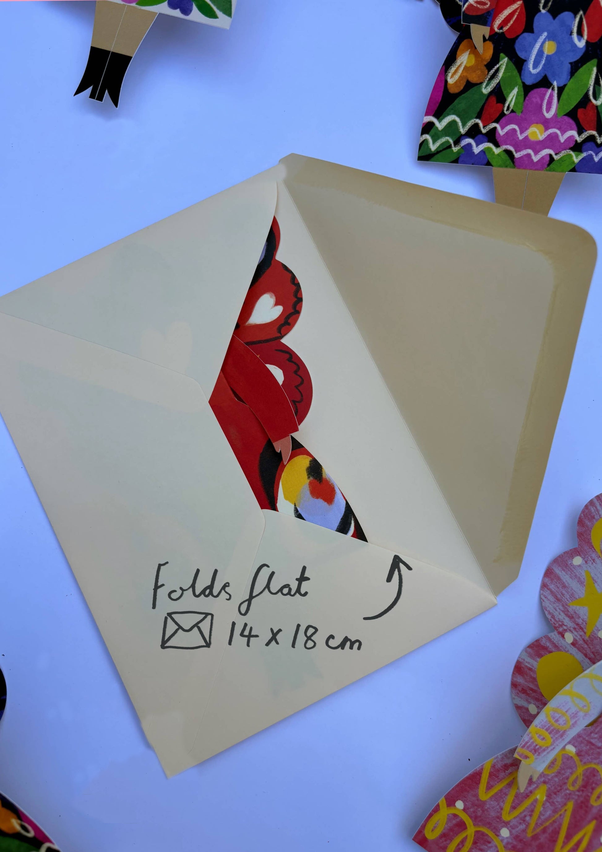 Card with a bird illustration and folding instructions on a colorful background