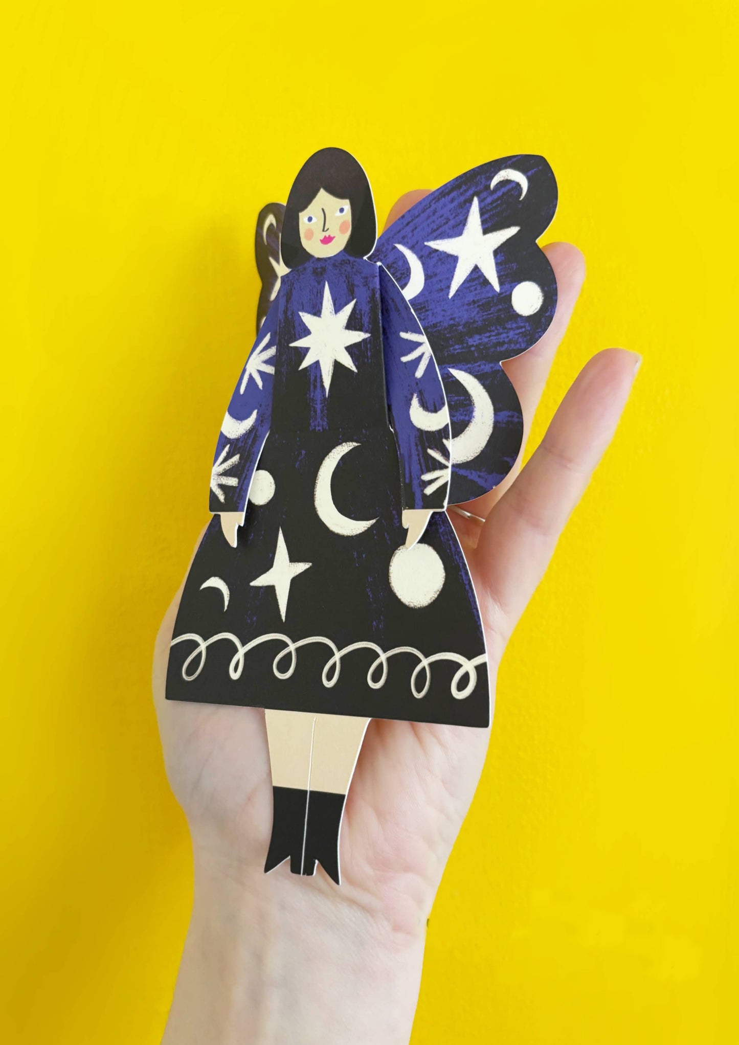Colorful paper dolls with butterfly wings and colorful dresses, featuring the brand 'Kitty Kenda'.