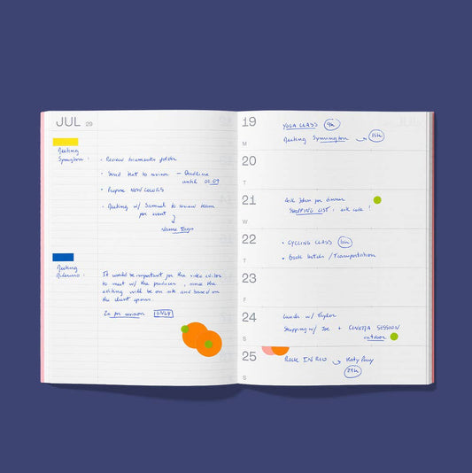 An open weekly planner notebook showing two lined pages with handwritten notes, a calendar layout, and small colored stickers, centered on a dark blue background with the text 'NOTES WEEK (OPTION 2)' below.