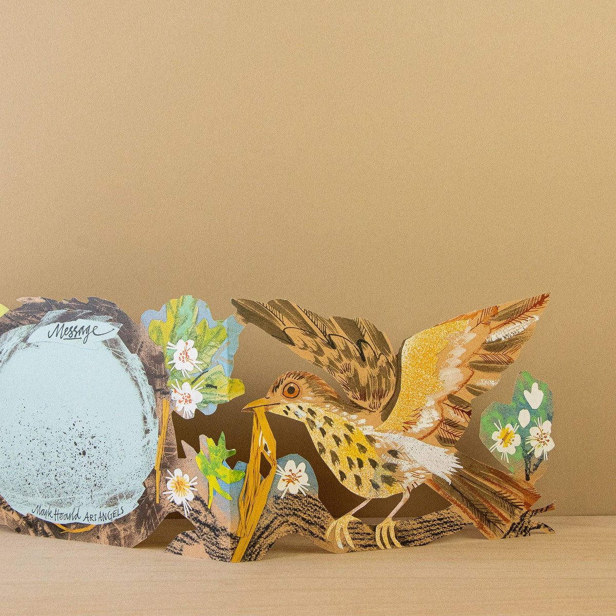 Pop-up card with a bird and nature elements on a beige background