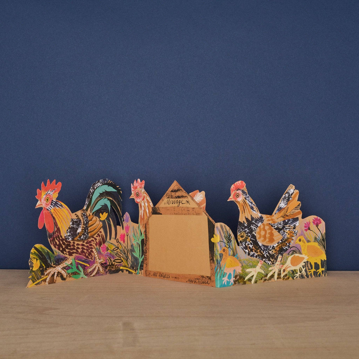 Decorative set with rooster and hen figures on a blue background