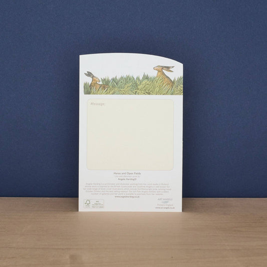 Notebook with rabbit illustration on a blue background