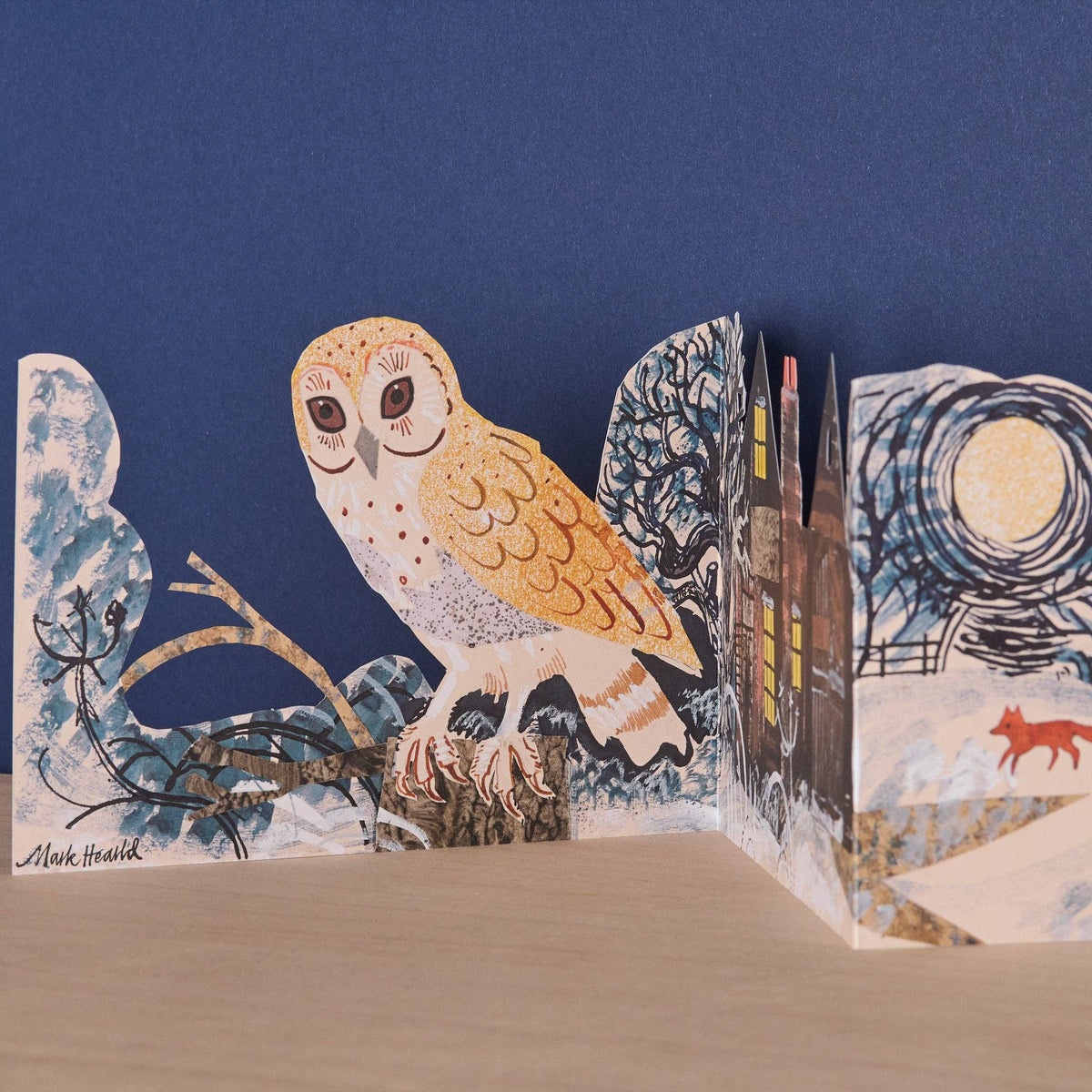Pop-up book with an owl illustration on a blue background