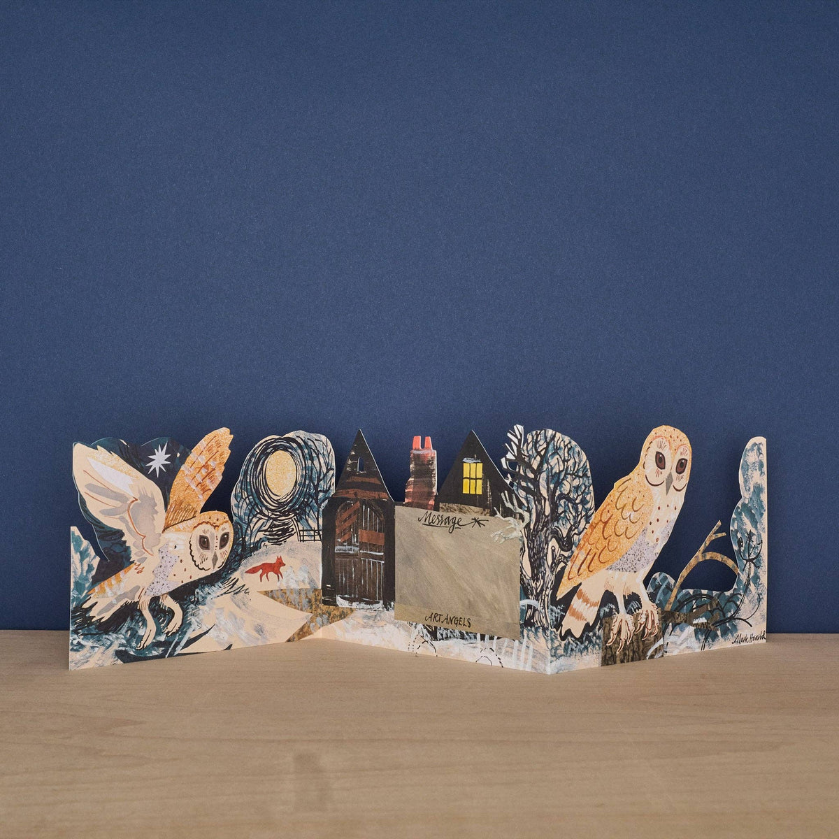 Pop-up card with owl design on a blue background