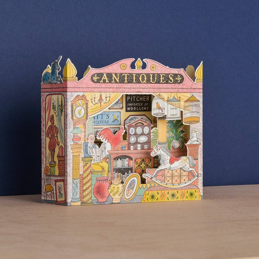 Decorative box with vintage antiques store design on a blue background