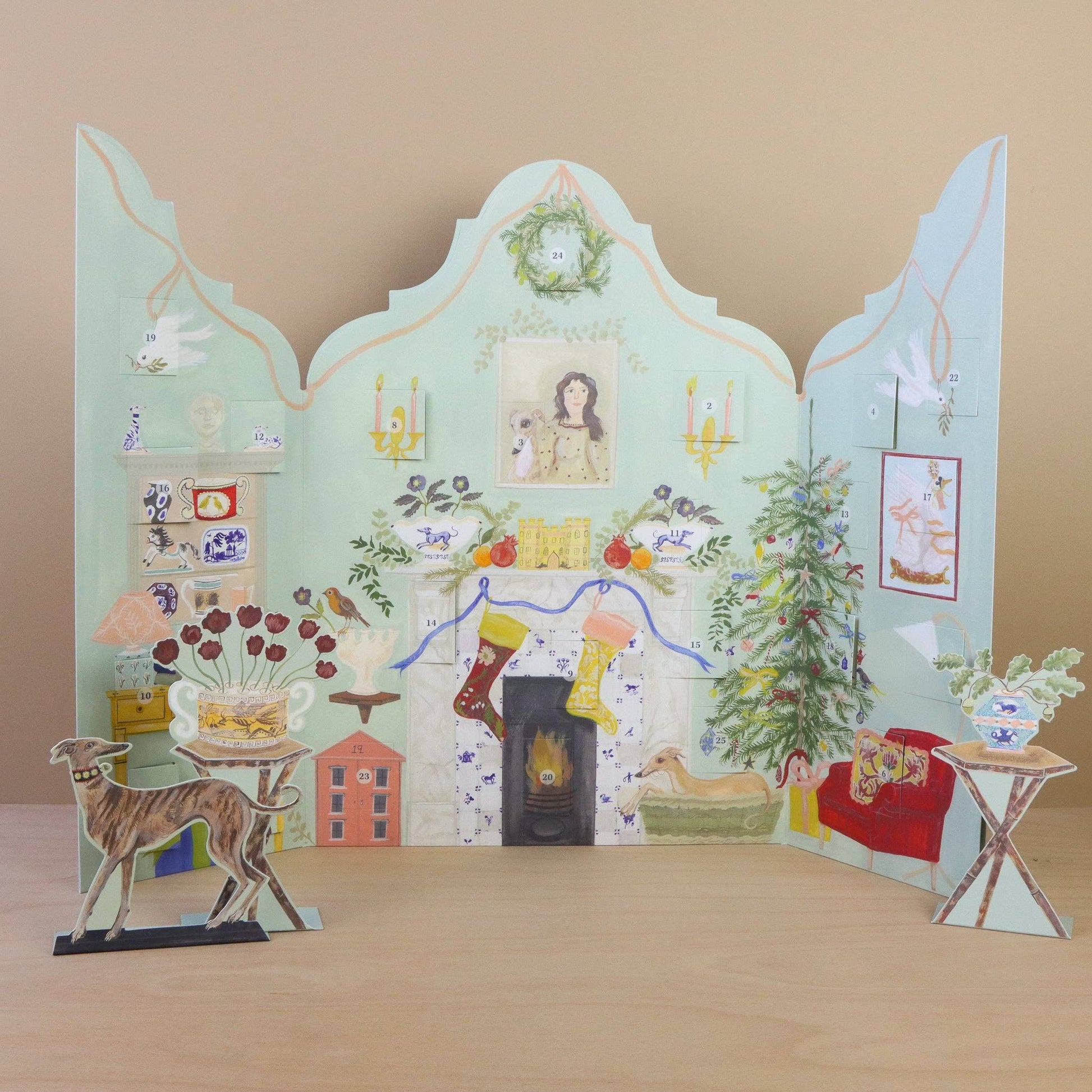 Decorative paper scene with various elements on a wooden surface and beige background