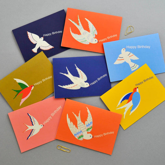 Set of colorful birthday cards with bird illustrations on a gray background