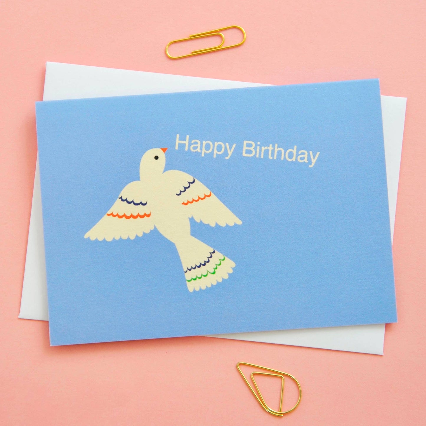 Birthday card with a dove illustration and 'Happy Birthday' text on a pink background