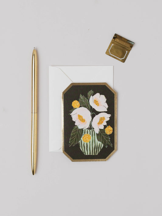 Decorative card with floral design, pen, and seal on a light gray background. Peonies