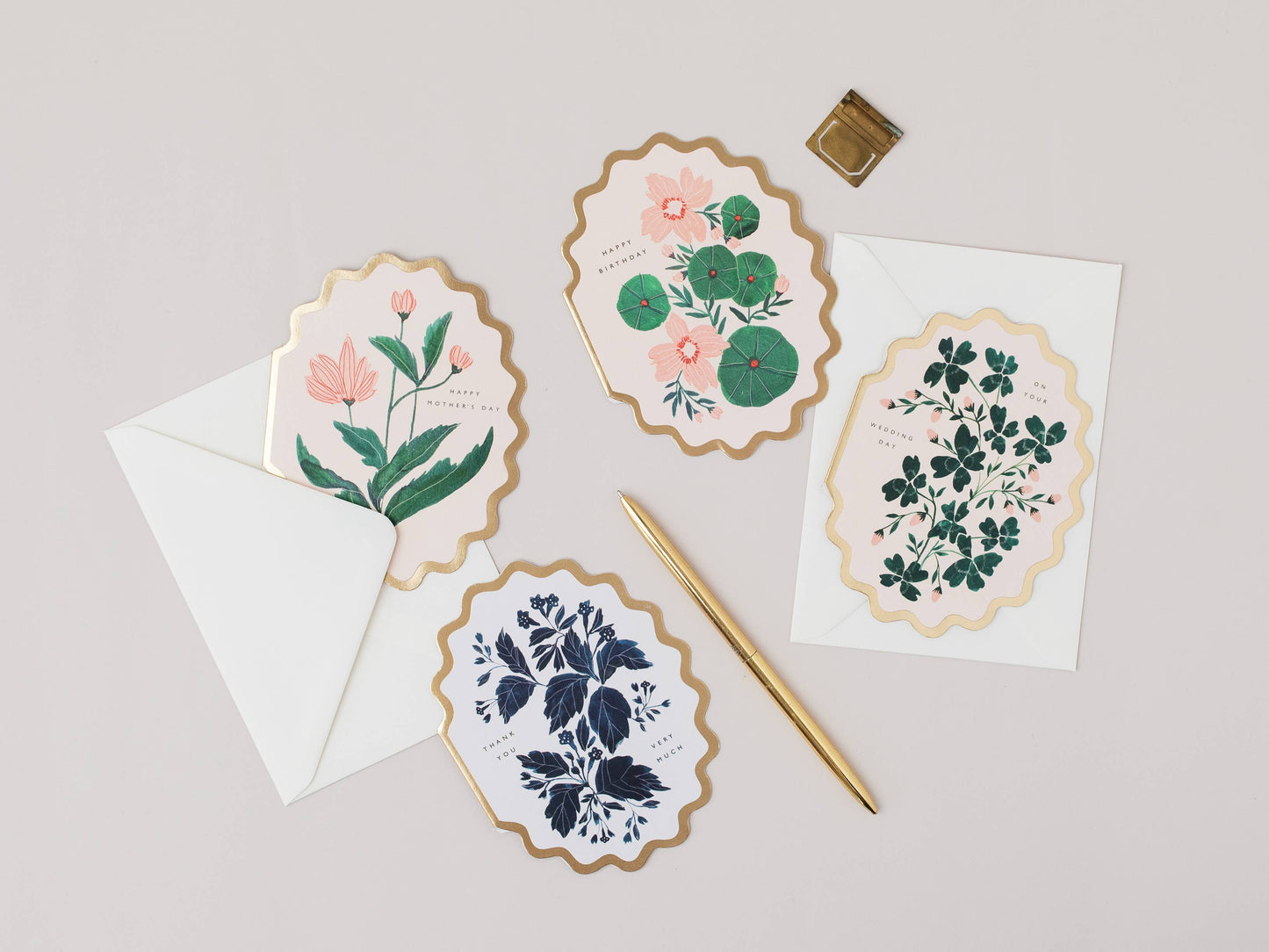 Set of floral cards with envelopes on a light gray background