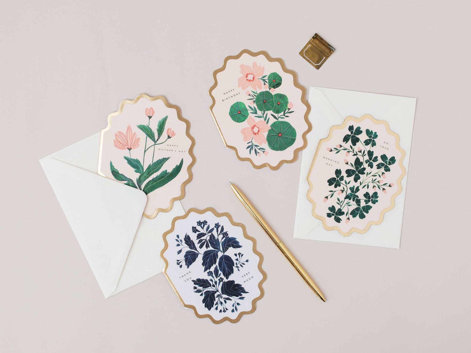 Set of floral cards with envelopes on a light gray background
