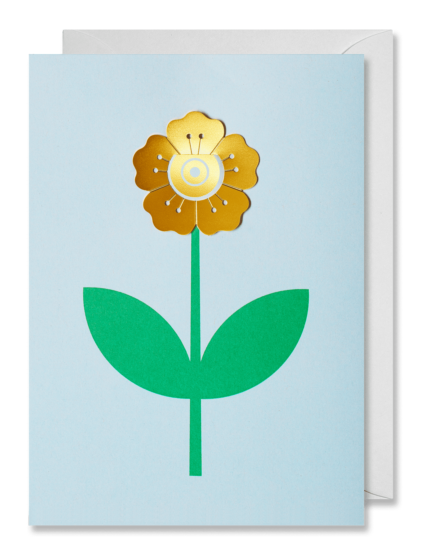 A square greeting card with a minimalist flower design, featuring a gold metallic flower head, green stem and leaves, and a pale blue background. A white envelope is partially visible behind the card against a dark green backdrop.