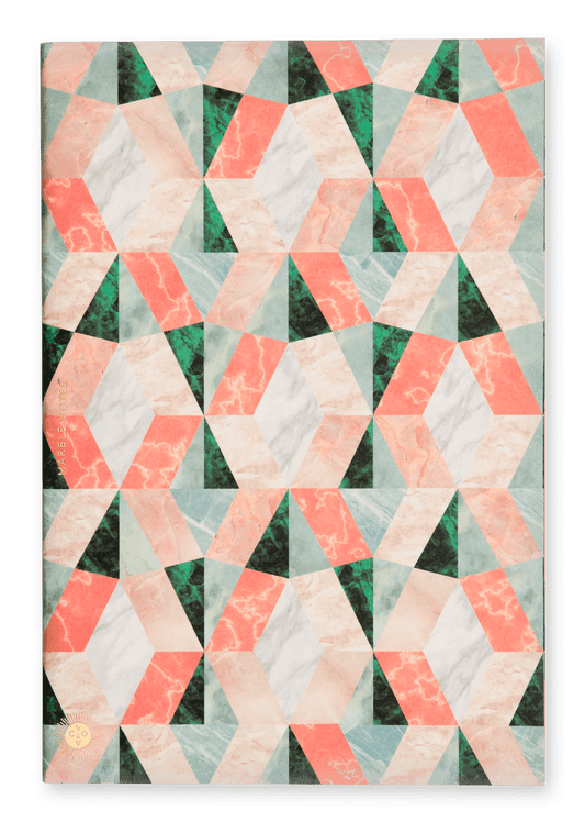 Quilt with geometric pattern on a green, pink, black background