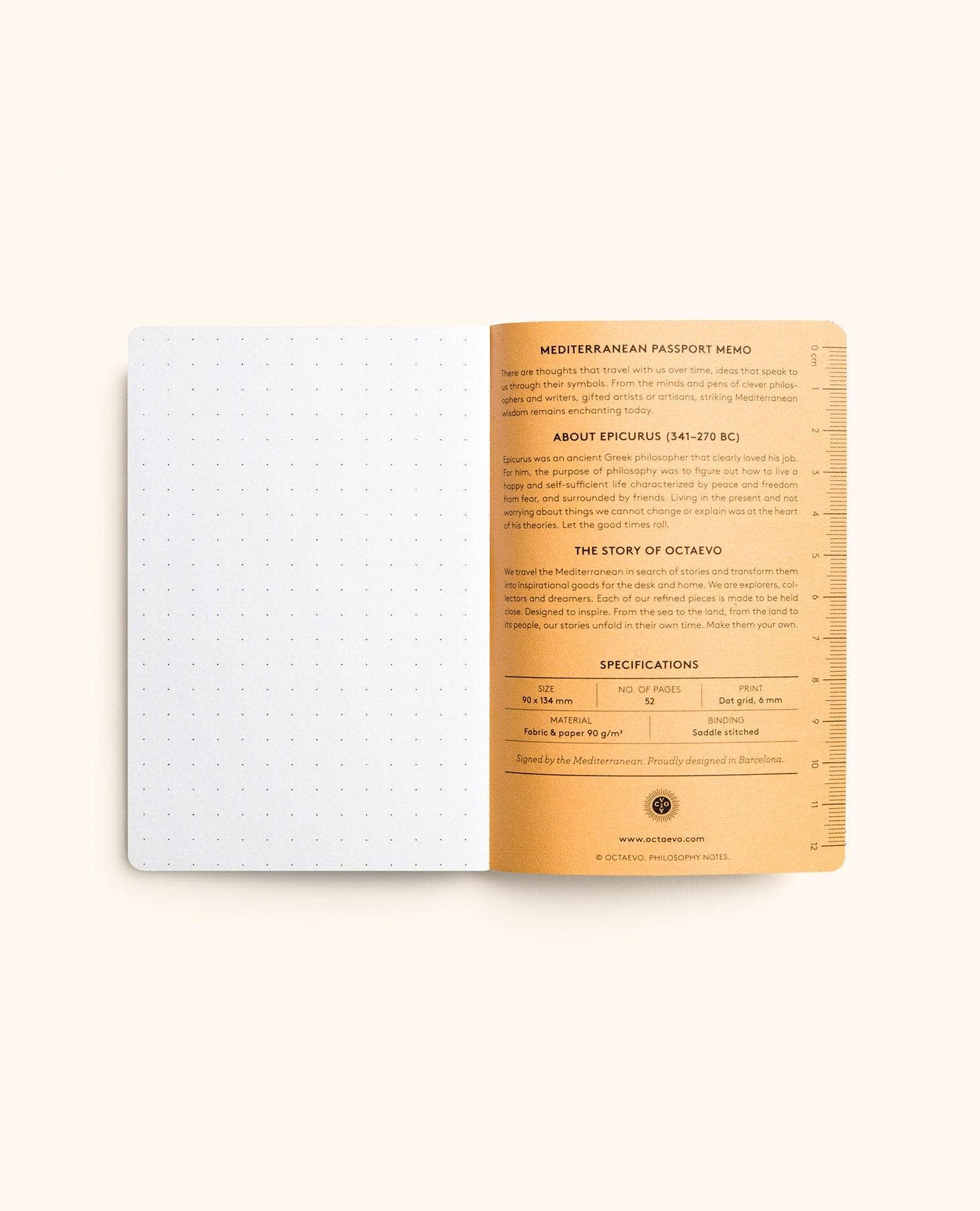 An open notebook or booklet on a light beige background. The left page is white with a faint dotted grid, and the right page is a warm tan/beige text page with headings and paragraphs.