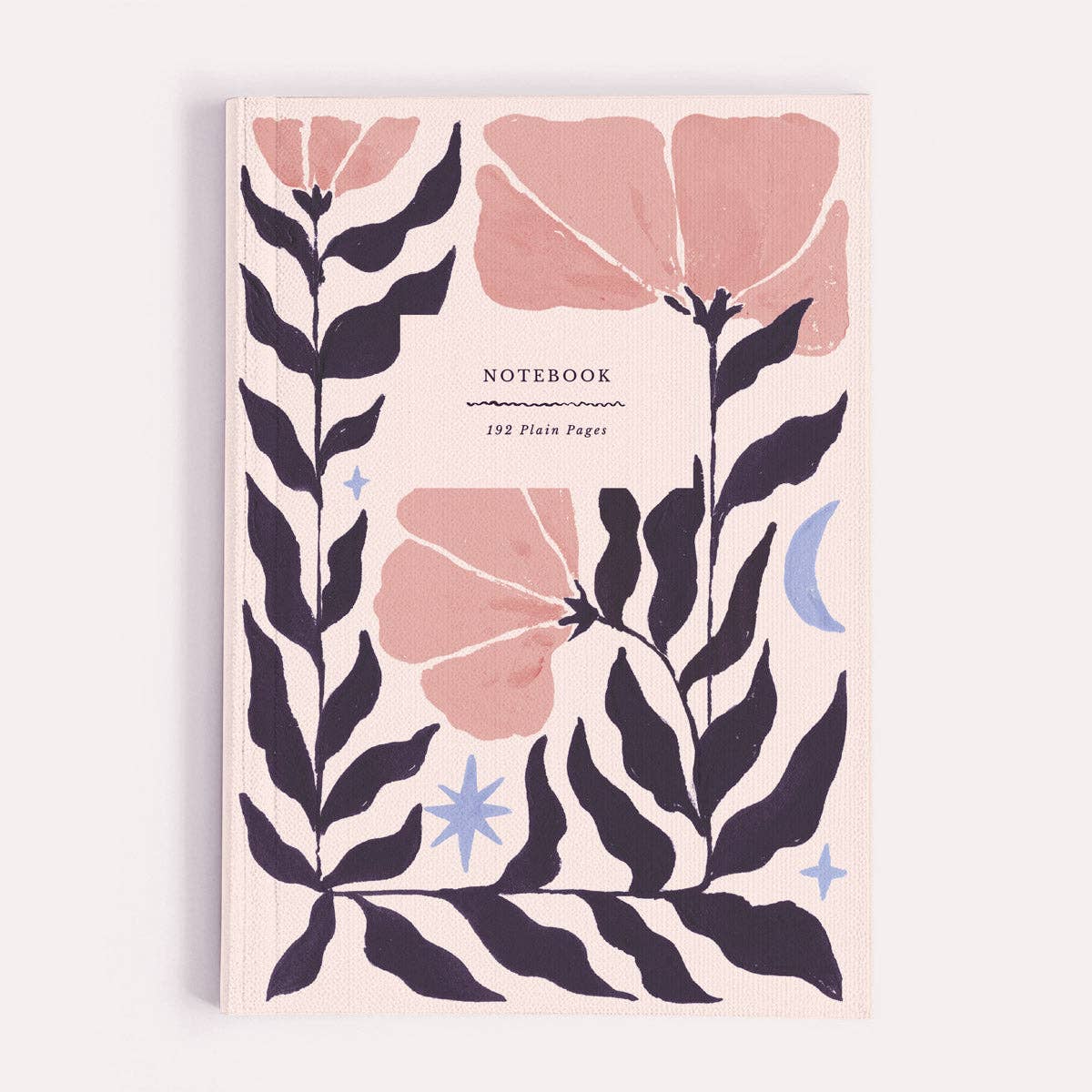 Notebook with floral design on a light pink background