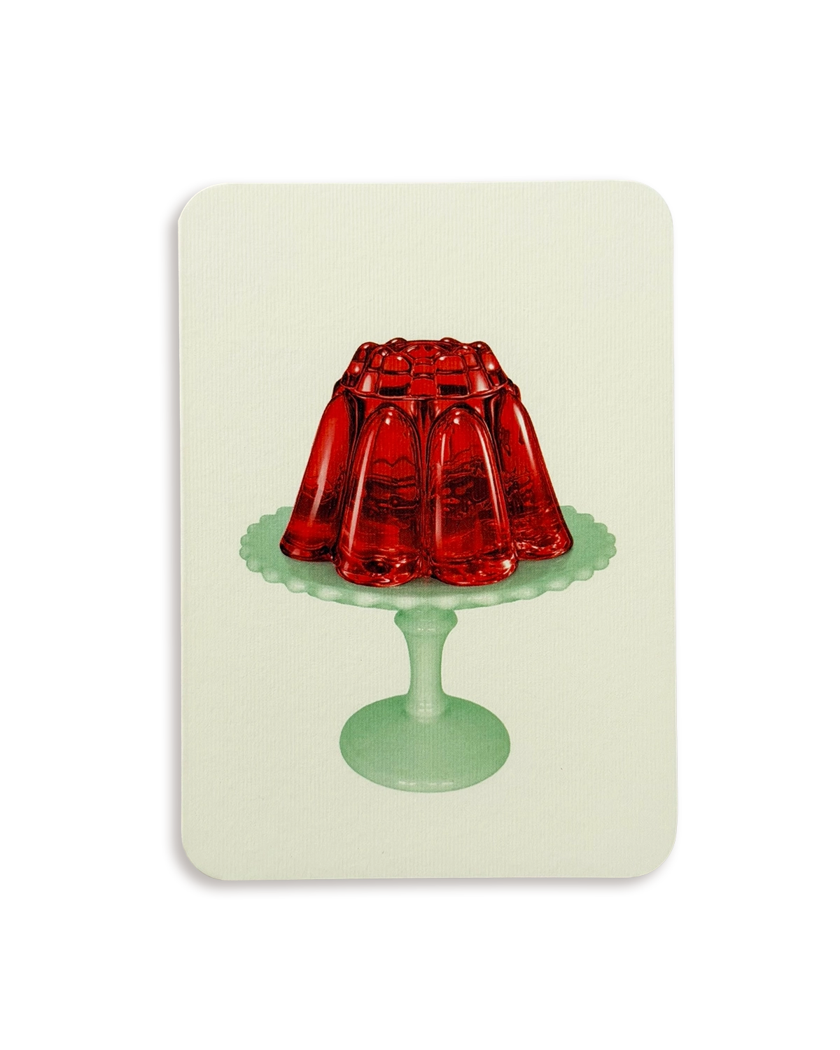 A rectangular art print or card with rounded corners, featuring a retro illustration of a red jelly mold on a mint green pedestal stand against a pale cream background.